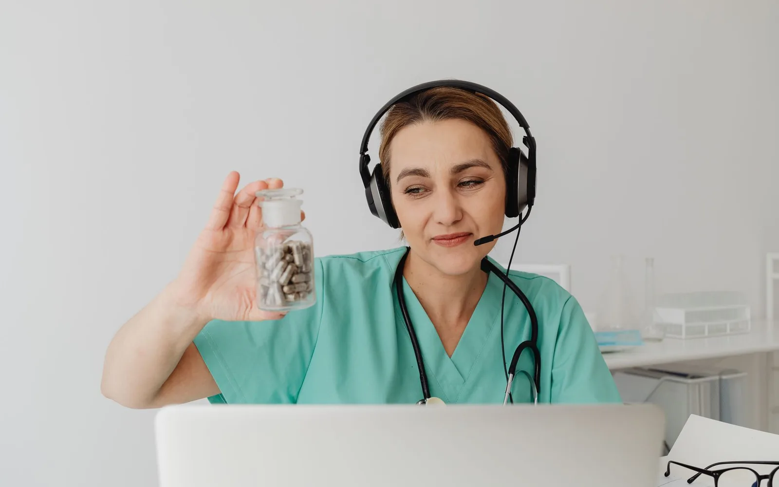 A clinician discussing coordinated ADHD medication and antidepressant care by telehealth